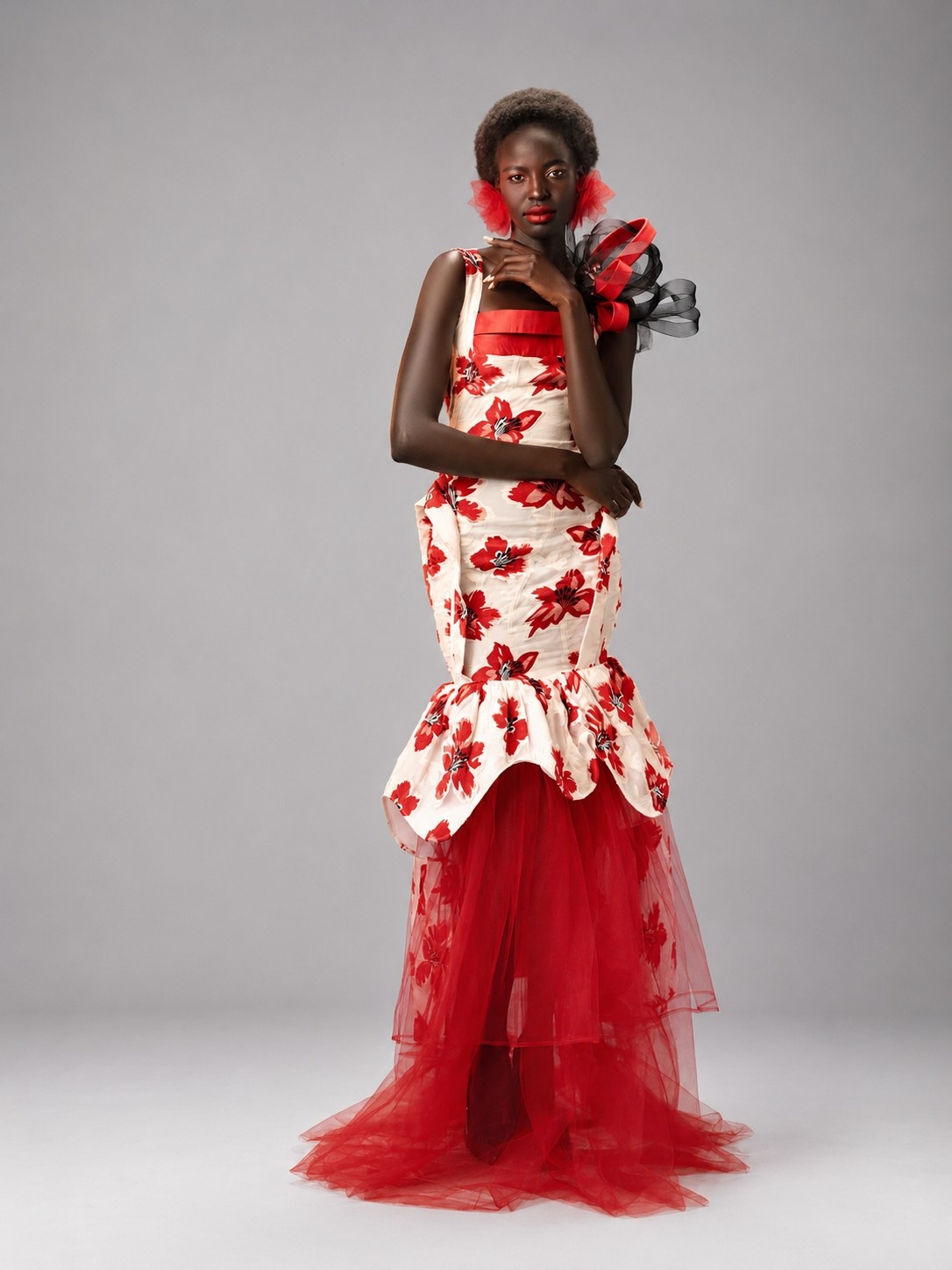 Close editorial portrait of the Crimson Bloom gown with floral detailing